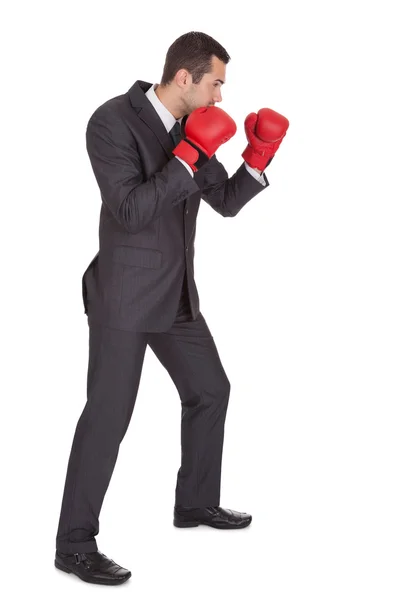 Empresário competitivo em luvas de boxe — Fotografia de Stock