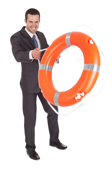 Jonge zakenman met leven buoy — Stockfoto