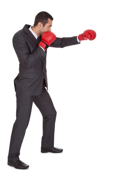 Competitive businessman in boxing gloves — Stock Photo, Image