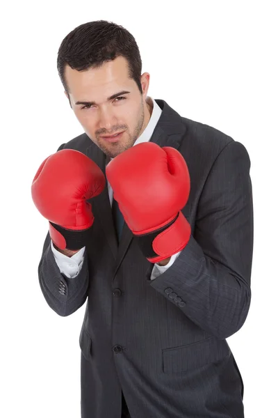 Empresário competitivo em luvas de boxe — Fotografia de Stock