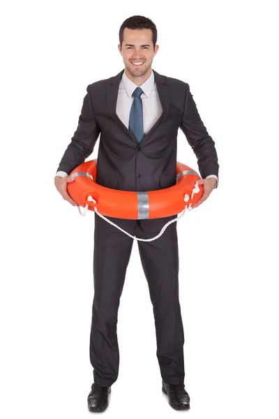 Jonge zakenman met leven buoy — Stockfoto