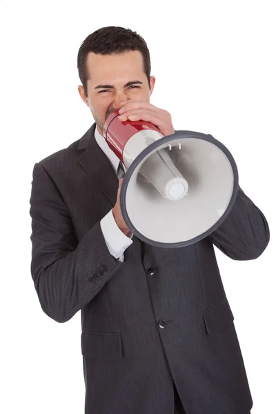 Businessman screaming in megaphone — Stock Photo, Image