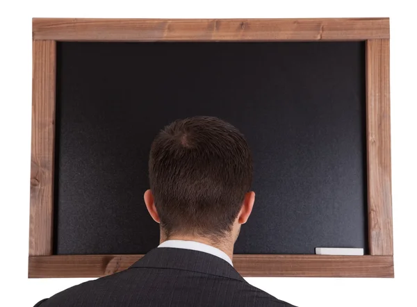 Podnikatel stojí vepředu na tabuli — Stock fotografie