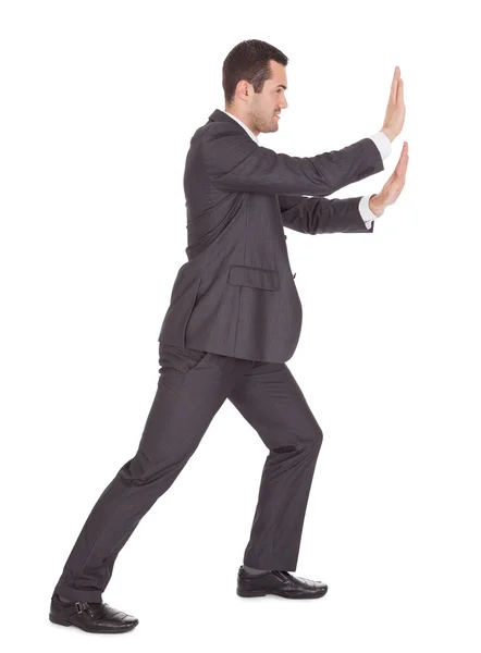 Successful businessman pushing copy-space — Stock Photo, Image