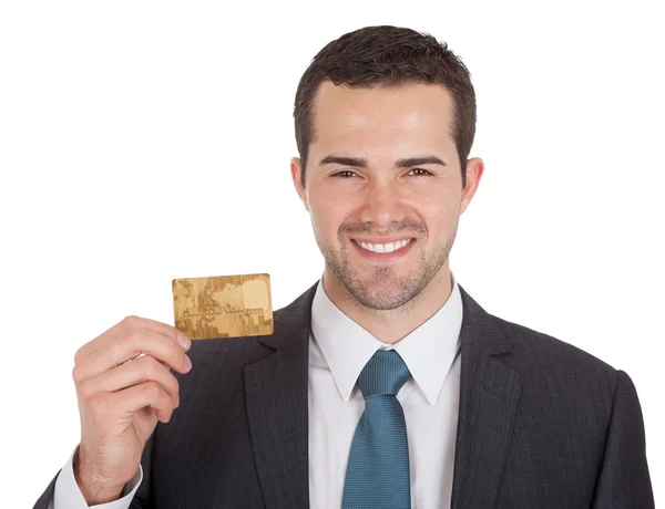 Успішний бізнесмен тримає кредитну картку — стокове фото