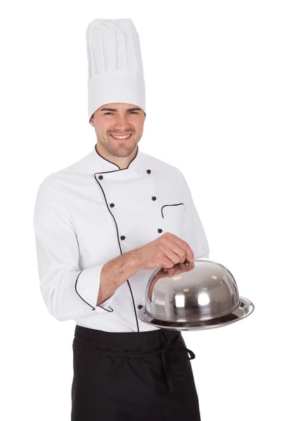Portrait of happy chef holding tray — Stock Photo, Image