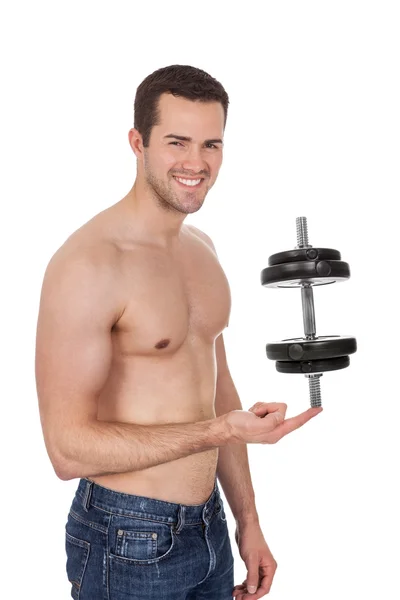Young bodybuilder male holding dumbbell — Stock Photo, Image