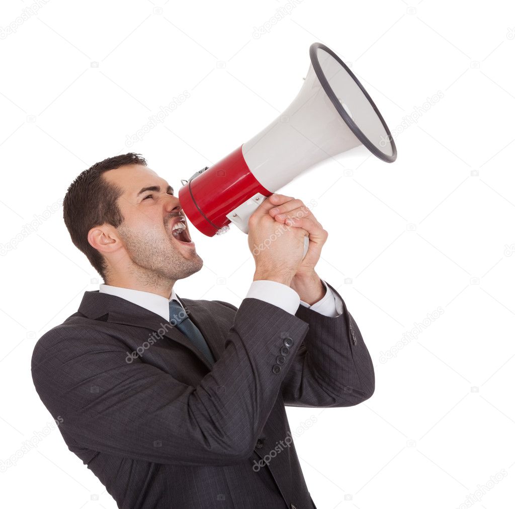Businessman screaming in megaphone