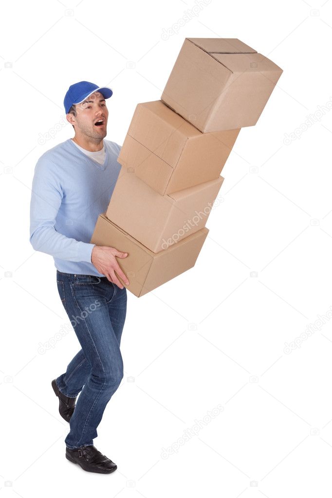 Young delivery man with falling boxes