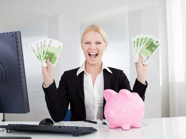 Businesswoman holding euro currency notes — Stock Photo, Image