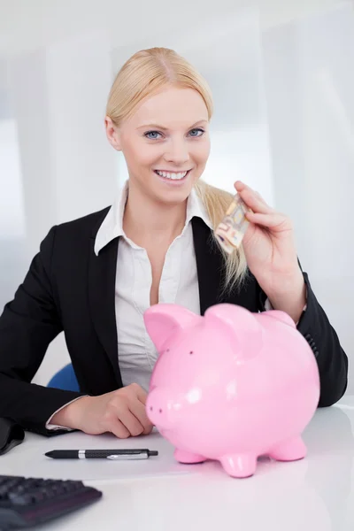Businesswoman holding euro currency — Stock Photo, Image