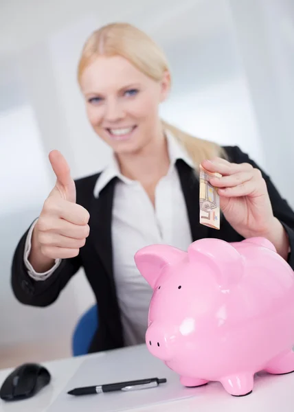 Businesswoman holding euro currency — Stock Photo, Image