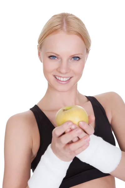 Güzel genç fitness kadın apple ile — Stok fotoğraf