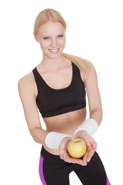 Beautiful young fitness woman with apple — Stock Photo, Image