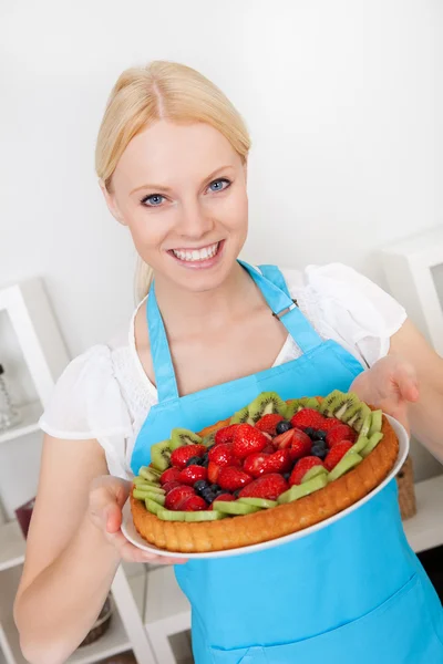 Beautiful young woman holding cake — Stock Photo, Image