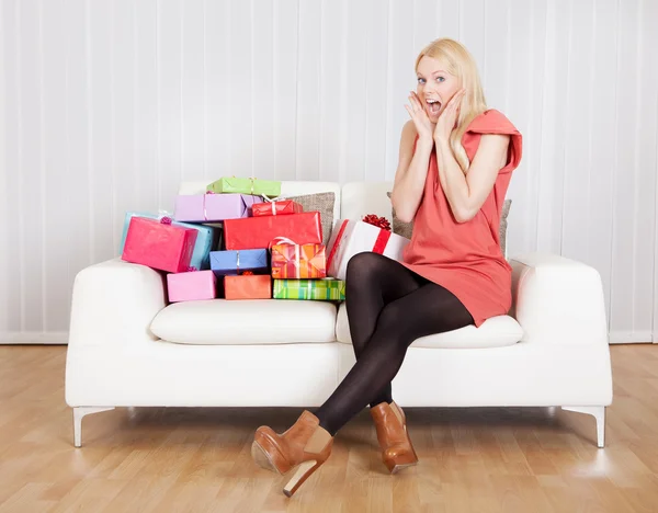 Beautiful young woman with her presents — Stock Photo, Image