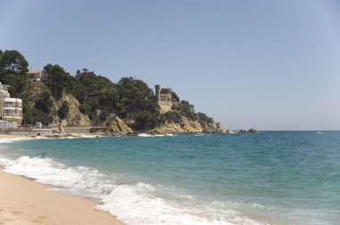 Spain. An old fortress on the rock in Lloret de Mar. clipart