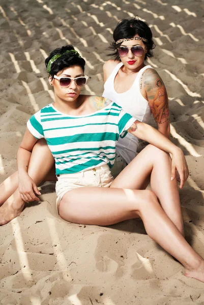 stock image Two adorable women with tattoos wearing sunglasses