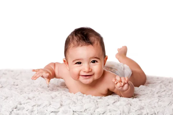 Happy baby laying on belly — Stock Photo, Image