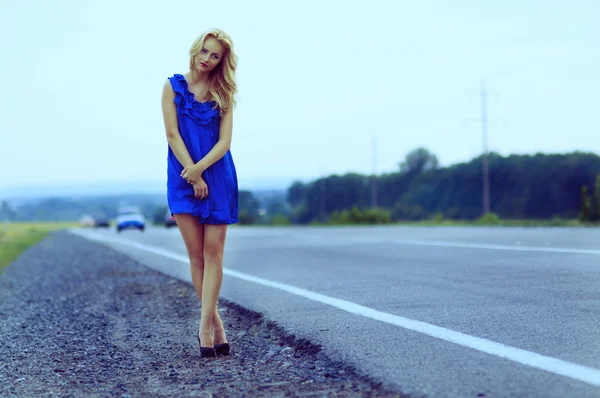 stock image Lonely girl on the roadside