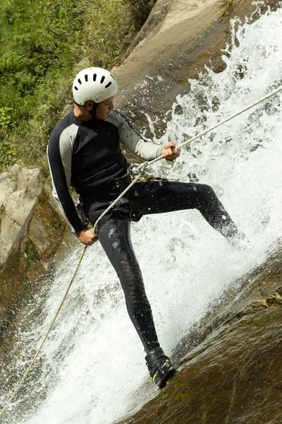 Canyoning Guide Descending A Class Three Waterfall — Zdjęcie stockowe