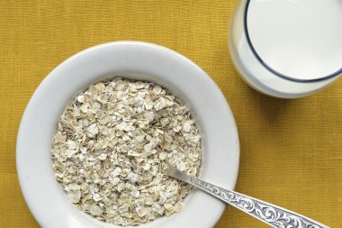 Oat-flakes with milk clipart