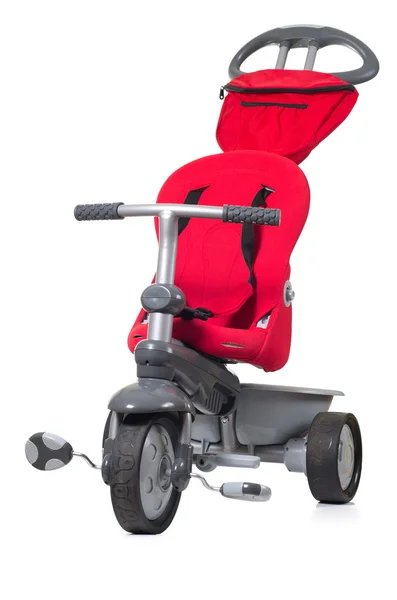 Червоний триколісний велосипед дитини . — стокове фото