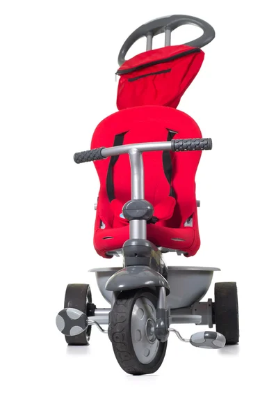 Червоний триколісний велосипед дитини . — стокове фото