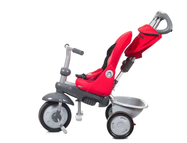 Barnets röda trehjuling. — Stockfoto