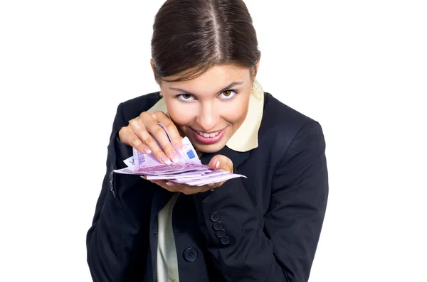 Business woman listening to the rustle of money — Stock Photo, Image