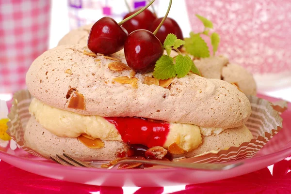 Meringue cakes with almond cream and cherry — Stock Photo, Image