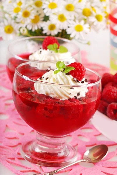 Jelly dessert with raspberry and whipped cream — Stock Photo, Image