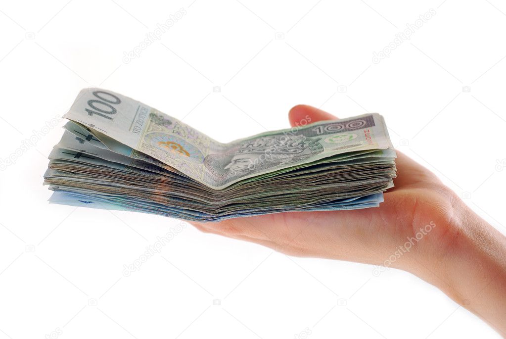 Hand holding stack of polish banknotes