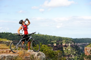 Man drinks after cycle clipart