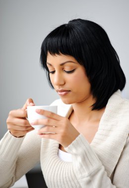 Woman drinking tea clipart