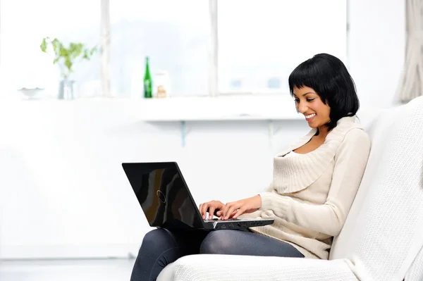Happy woman surfing the internet from home — Stock Photo, Image