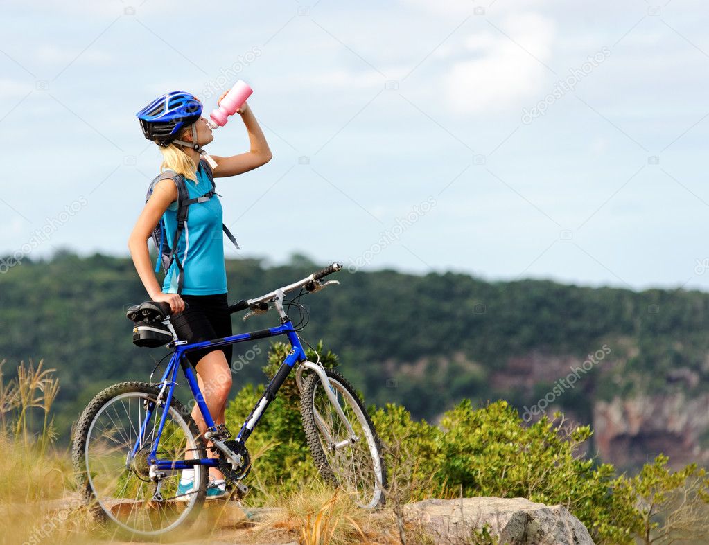 Mountain bike girl drinking