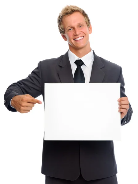 Affärsman håller ren pappersark — Stockfoto
