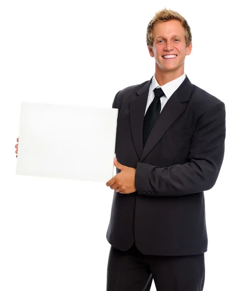 Üzletember tartja tiszta papírlapra — Stock Fotó