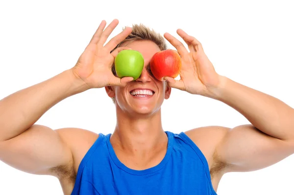 Счастливый спортсмен с двумя яблоками — стоковое фото
