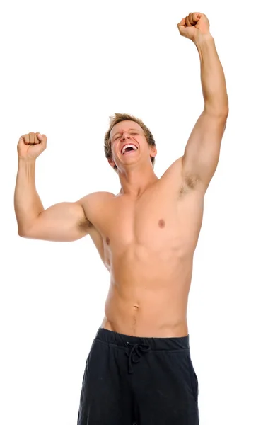 Возбужденный спортсмен поднимает руки к победе — стоковое фото