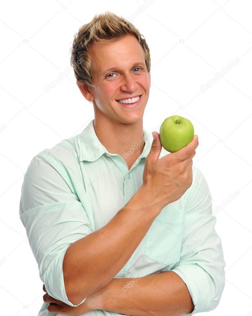 Handsome young man holding an apple Stock Photo by ©Daxiao_Productions