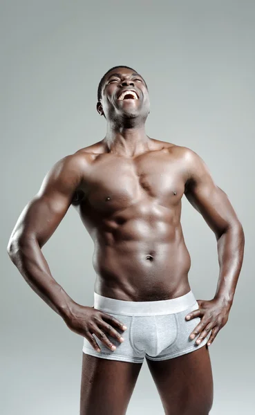 Good looking muscular man laughing — Stock Photo, Image