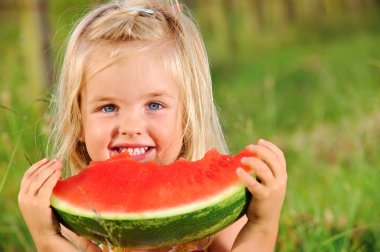 Young girl smiles with watermelon clipart