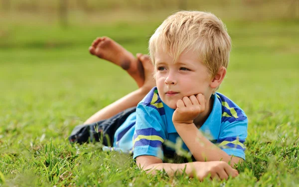 Cute child relaxing outdoors — Stock Photo, Image