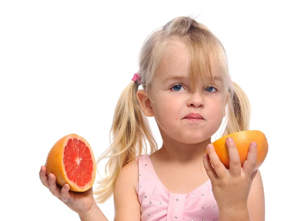 Girl has sour fruit face — Stok fotoğraf