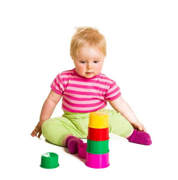 Säugling spielt und lernt isoliert auf Weiß Stockbild