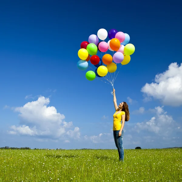 Meisje met kleurrijke ballonnen — Stockfoto
