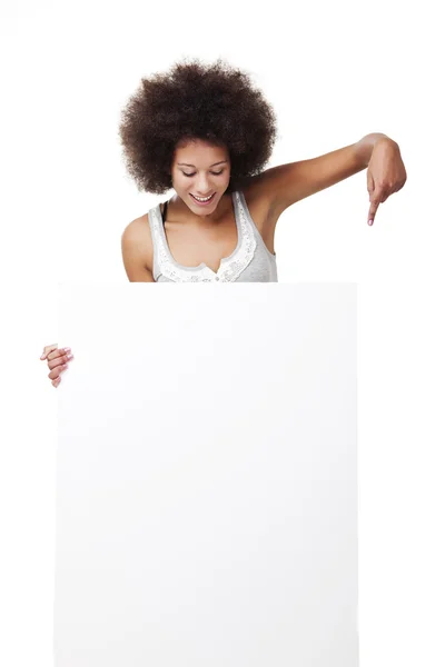 Woman holding a white billboard — Stock Photo, Image