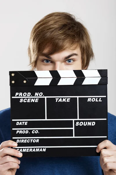 Showing a clapboard — Stock Photo, Image
